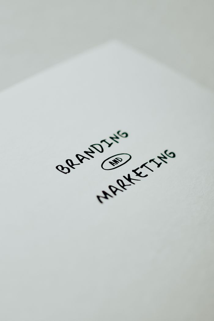 gallery-5 Minimalistic design showcasing 'branding and marketing' text for business strategy visuals.